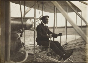 Wilbur Wright in the flyer, 1908. Private Collection.