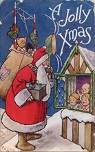 A Jolly Xmas, 1934. Father Christmas holds a transmitter with loudspeaker and aerial.
