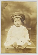 Photographic postcard with image of a small child, 1918-1930. Creator: Unknown.