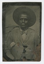 Tintype portrait of a man wearing a hat and suit, late 19th century. Creator: Unknown.