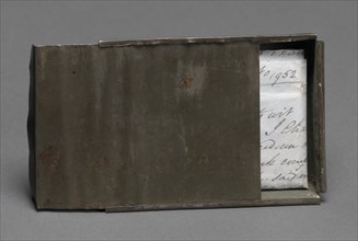 Freedom papers and handmade tin carrying box belonging to Joseph Trammell, 1852. Creator: Joseph Trammell.