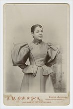 Cabinet card of an unidentified woman photographed by J. P. Ball & Son, 1887-1900. Creator: J. P. Ball & Son.