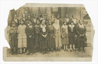 Photograph of Lucille Brown among Poro agents and one small child, 1915-1953. Creator: Unknown.
