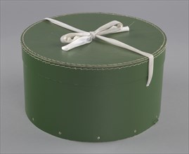 Green circular hatbox with lid from Mae's Millinery Shop, 1941-1994. Creator: Unknown.