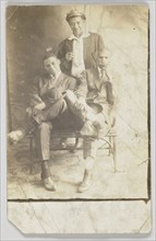 Photographic postcard of three unidentified men, 1904-1918. Creator: Unknown.