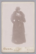 Cabinet card of an unidentified woman wearing a top hat and a fur stole, ca. 1895. Creator: Justus C. Swan.