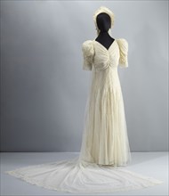 Wedding dress worn by Lollaretta Pemberton with veil and headpiece, 1939. Creator: Unknown.
