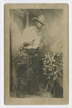 Photograph portrait of a man dressed as a cowboy, early 20th century. Creator: Unknown.