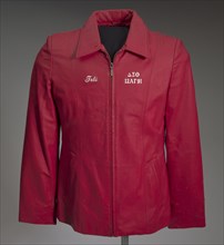 Red leather Delta Sigma Theta jacket owned by Tobi Douglas A. Pulley, 1991. Creator: La-Rose.