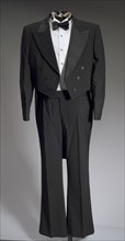 Black tail coat with white pocket handkerchief worn by Cab Calloway, 1976-1995. Creator: After Six.