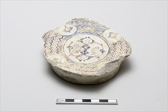 Fragmentary base of a bowl surrounded by wave design, Saljuq period, early 13th century. Creator: Unknown.