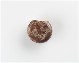 A round marker for games. Chipped, Roman period, (3rd-4th century?). Creator: Unknown.