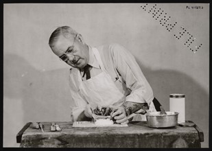 Frank Earl Holden Demonstrates Cutting into Mineral, January 18, 1951. Creator: United States National Museum Photographic Laboratory.
