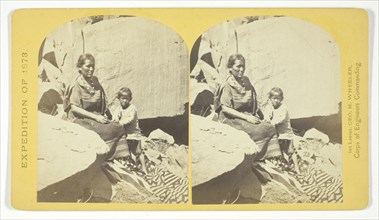 Navajo Indian Squaw, and Child, at their home, in Cañon de Chelle, 1873. Creator: Tim O'Sullivan.