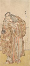 Ikunojo III as Chiyosaki Striking the Chozubachi; a Shower of Gold Coin Flies, late 18th century. Creator: Shunsho.