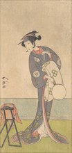 The First Nakamura Tomijuro as an Oiran Standing in a Room, 1771. Creator: Shunsho.