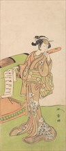 The Actor Iwai Hanshiro IV in Female Role, Standing Beside a Litter, 1726-1792. Creator: Shunsho.