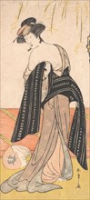 The Actor Nakamura Riko as an Oiran Tying Her Obi, ca. 1779. Creator: Shunsho.