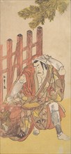 The Fourth Matsumoto Koshiro as an Outlaw Looking at a Wooden Ninsogaki, ca. 1779-83. Creator: Shunsho.