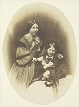 Mrs. Craik Holding Cat, c. 1858. Creators: Unknown, Benjamin Mulock.