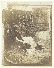 Mrs. Craik Reclining in Garden with Hat and Book, 1848/60. Creators: Unknown, Benjamin Mulock.