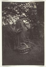 Woman Standing with Basket on Ground, 1870. Creator: Giraudon's Artist.