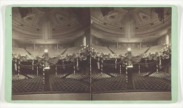 Untitled [auditorium decorated with US flags], late 19th century. Creator: Wright & Hartwell.