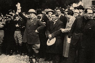 Benito Mussolini, between the members of the Fascist Party, shortly after the "March on Rome". Creator: Anonymous.