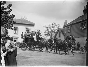 A horse-drawn coach driving past a group of cottages, Greater London Authority, 1895-1905. Creator: Charles William  Prickett.