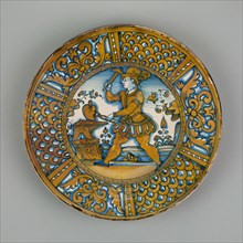 Display Plate with a Man Striking a Heart on an Anvil, Deruta, c. 1550. Creator: Unknown.