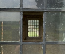 Window in the summerhouse, Hamsterley Hall, Hamsterley, County Durham, 2014. Detail looking through a window in the summerhouse, formerly a cupola from Beaudesert, Staffordshire, in the house's east g...