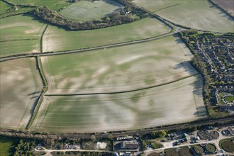Mount Pleasant, a henge enclosure crop mark, with associated round barrow earthwork, known as the Conquer Barrow, and nearby round barrows showing as crop marks, near Dorchester, Dorset, 2015.