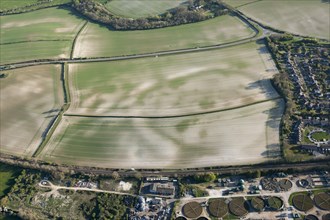 Mount Pleasant, a henge enclosure crop mark, with associated round barrow earthwork, known as the Conquer Barrow, and nearby round barrows showing as crop marks, near Dorchester, Dorset, 2015.