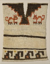 Tunic Fragment, Peru, A.D. 1470/1532. Cat motif. Embellished with feathers.
