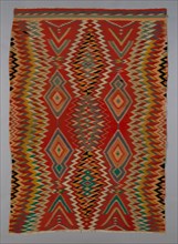 Germantown Eyedazzler Rug, Arizona, c. 1800/90. In 1864 the U.S. government forcefully resettled the Navajo in the Bosque Redondo reservation. The brightly coloured commercial yarns they received as p...