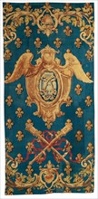Chancellerie, France, 1718/21. Winged crest and crossed maces on a ground of fleurs de lis. Woven at the Manufacture Royale des Gobelins.