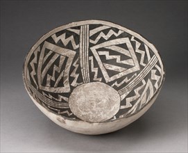 Bowl with Bold Black-on-White Diamond and Zizgag Motifs, A.D. 950/1400. Bone-colored bowl with interior decorations of bone-colored zig-zags, diamonds, and lines on a black background, a circle at the...