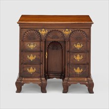 Bureau Table, c. 1770. Small wooden bureau with carved half-circle designs, gilded handles. Attributed to John Townsend.