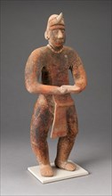 Standing Male Figure Holding a Plate, A.D. 100/400.