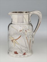 Pitcher, 1878. Silver, gold, and copper, hammered design featuring irises, fish and dragonfly, attributed to Edward C. Moore. Almost certainly inspired by the work of Katsushika Hokusai.