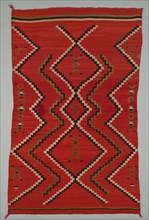 Sarape with Terraced Zigzag Design, 1865/85. A work made of wool, plain weave and dovetail tapestry weave; twined warp ends and selvages; looped and knotted corner tassels.