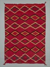 Sarape with Serrated Diamond Pattern, 1880/1900. A work made of wool, plain weave with "lazy lines" and dovetail tapestry weave; twined warp ends and selvages; looped and knotted corner tassels.