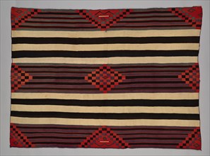 Chief Blanket (Third Phase), c. 1880. A work made of wool, plain weave with "lazy lines" and dovetail tapestry weave; warp and weft twining; corner tassles.