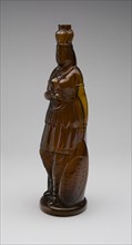 Bottle, 1867/75. Bottle in the shape of a Native American woman, known as the 'Indian Queen' design. Inscribed 'Brown's Celebrated Indian Herb Bitters'. Possibly made by Whitney Brothers Glass Works.