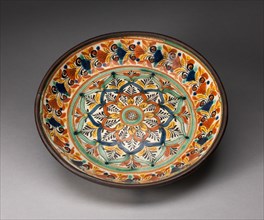 Plate, 1800/50. Glazed earthenware plate decorated with stylized leaves and flowers in red, yellow, green, dark blue, and white.