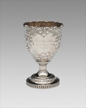 Goblet, 1852. Relief decoration of grapes and vine leaves, inscribed: 'James Brown Potter, from his Grandmother E.M.B.'.