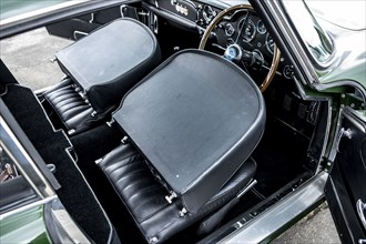 Folded down front seats of a 1961 Aston Martin DB4 GT previously owned by Donald Campbell. Creator: Unknown.