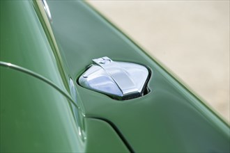 Petrol filler cap of a 1961 Aston Martin DB4 GT previously owned by Donald Campbell. Creator: Unknown.