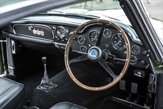 Steering wheel and dashboard of a 1961 Aston Martin DB4 GT previously owned by Donald Campbell. Creator: Unknown.