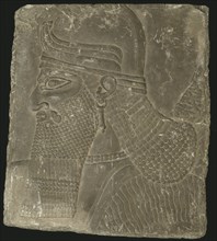 Relief Showing the Head of a Winged Genius, Neo-Assyrian Period, reign of Ashurnasirpal II (883-859  Creator: Unknown.